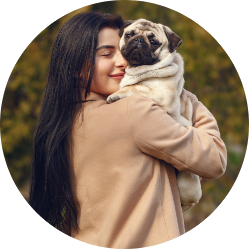happy woman holding pug