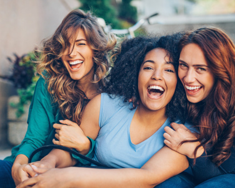 three friends laughing