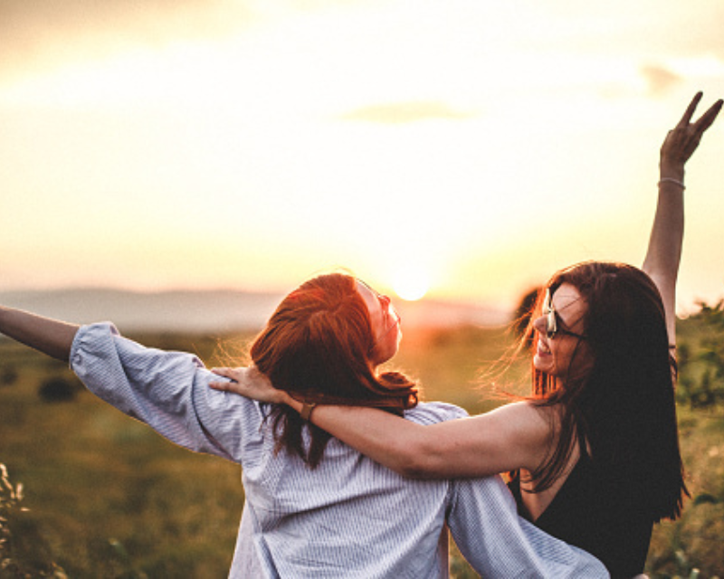two women hugging each other