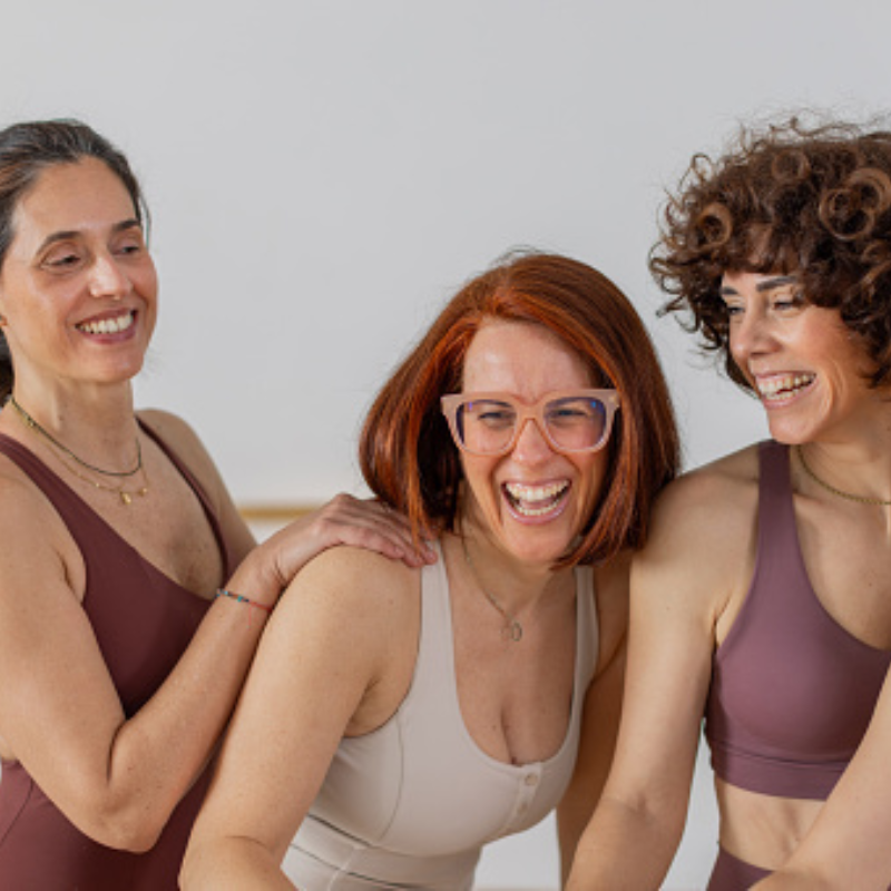 women laughing during workout